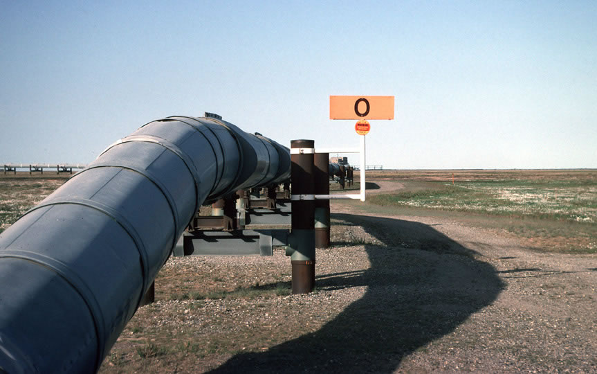 The Trans-Alaska Pipeline elevated on supports across open tundra.