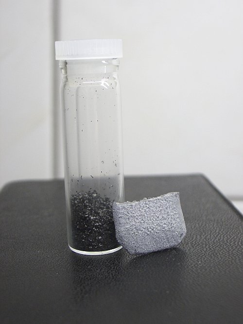 Chunks and filings of neodymium metal.